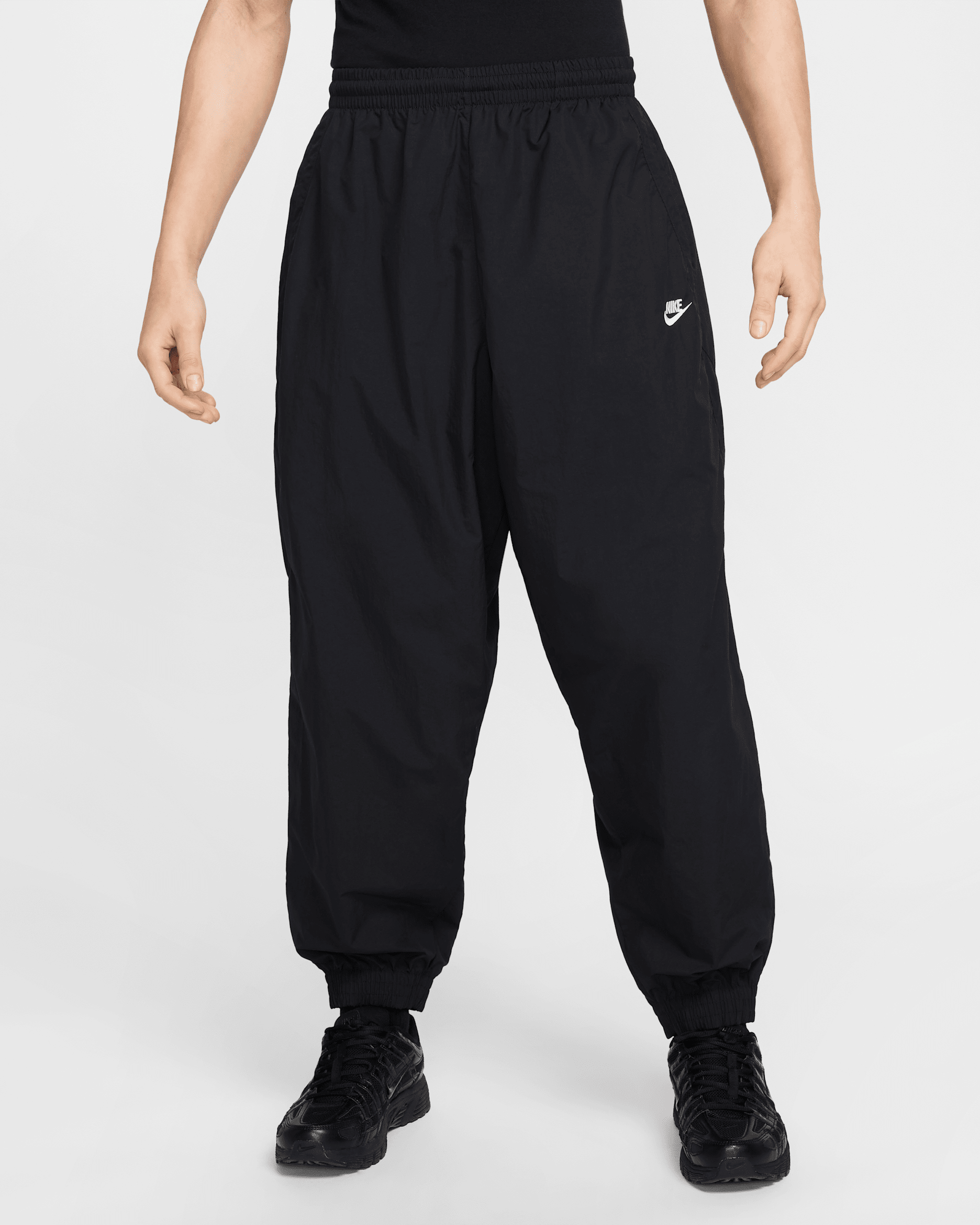 Nike Club Men's Oversized Woven Tracksuit Bottoms. Nike SG